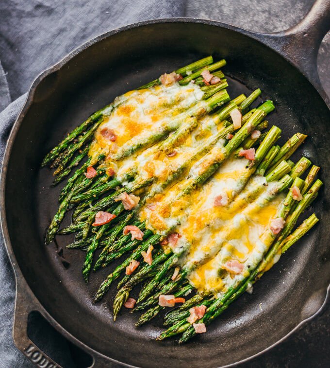 This baked asparagus is an easy side dish with melted cheese and bacon.