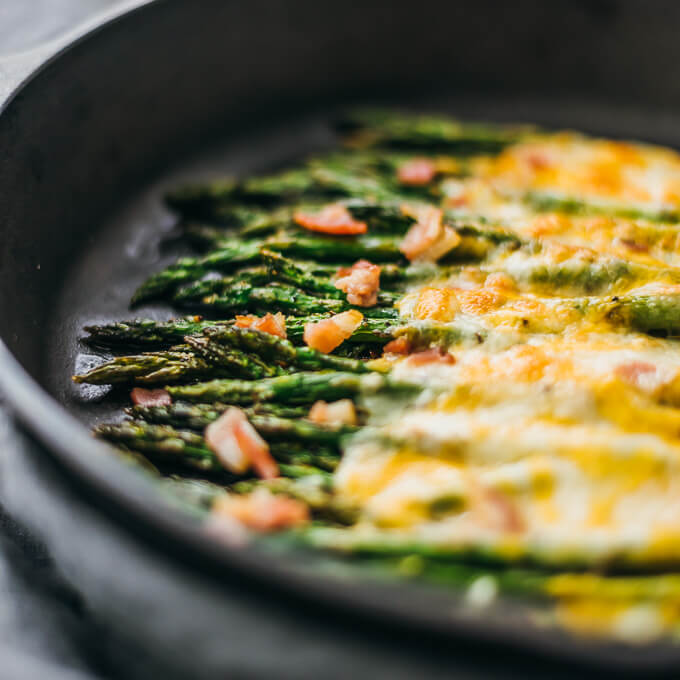 Here’s an easy side dish recipe: baked asparagus topped with melted cheese and bacon.