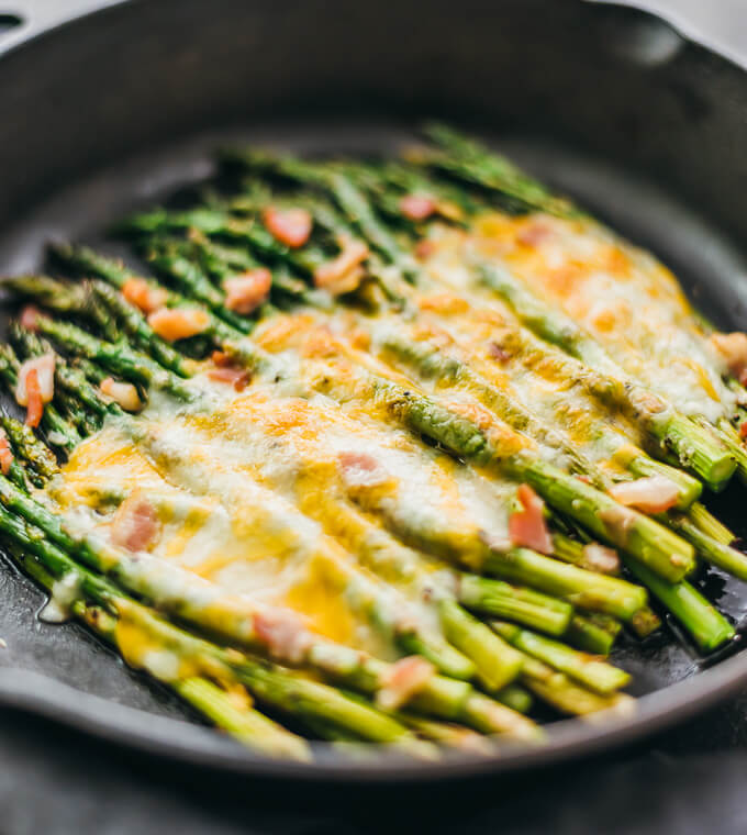 Here’s an easy side dish recipe: baked asparagus topped with melted cheese and bacon.