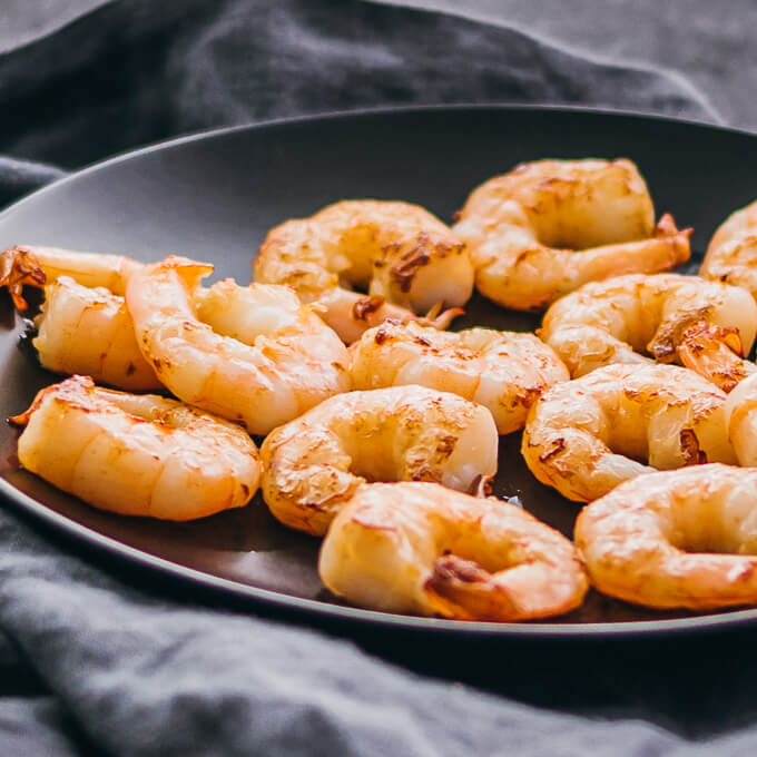 pan seared shrimp on black plate