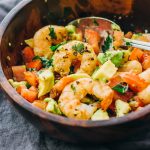 shrimp avocado salad in wooden bowl