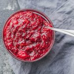 overhead view of cranberry sauce with spoon