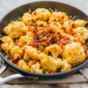 This easy roasted cauliflower is a super comforting low-carb meal, loaded with bacon and cheese.