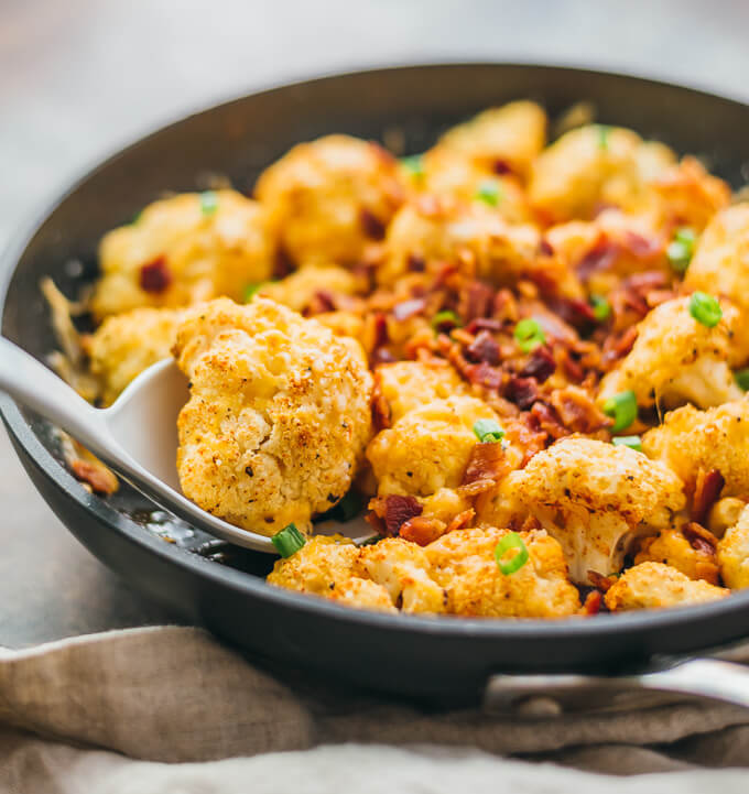 This easy roasted cauliflower is a super comforting low-carb meal, loaded with bacon and cheese.