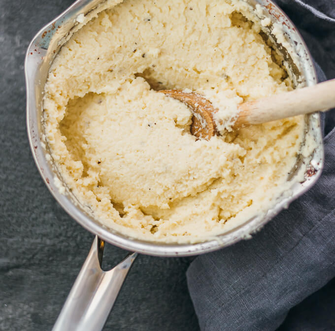 heating mashed cauliflower in saucepan