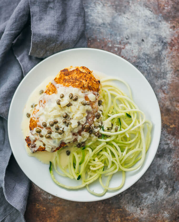 overhead view of caper chicken and spiralized zucchini