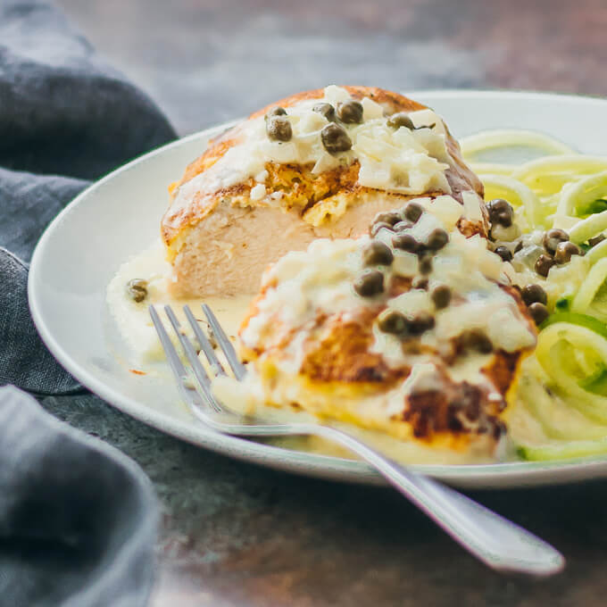 chicken sliced open and served with creamy caper sauce