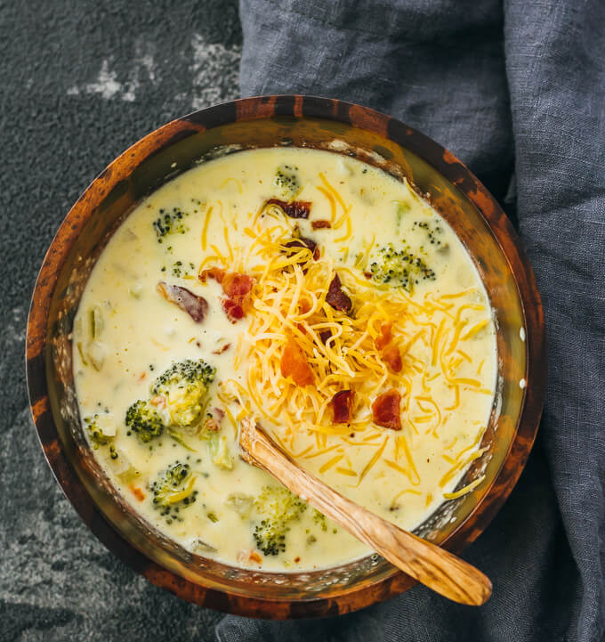 broccoli cheddar soup served in wooden bowl