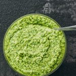 pesto sauce served in glass bowl with spoon