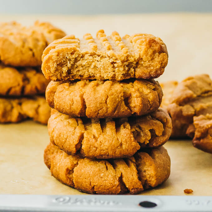 stack of peanut butter cookies, with a bite taken out