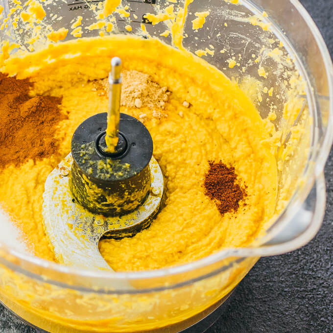 Pumpkin hummus in food processor with ground spices