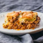 single serving of zucchini lasagna on white plate