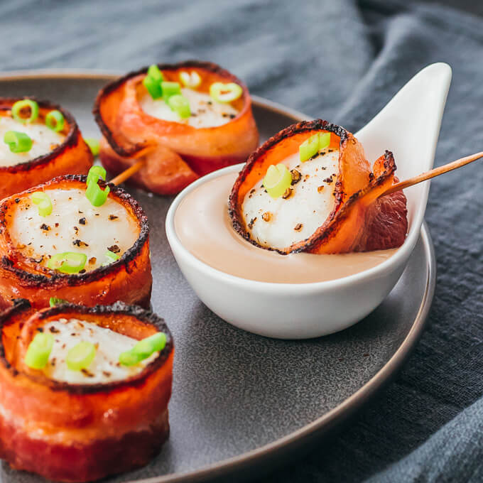 Easy scallops wrapped in bacon being served with balsamic mayo sauce