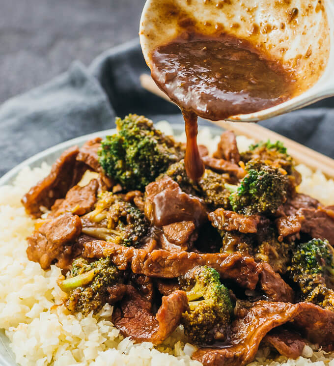 pouring sauce over beef and broccoli
