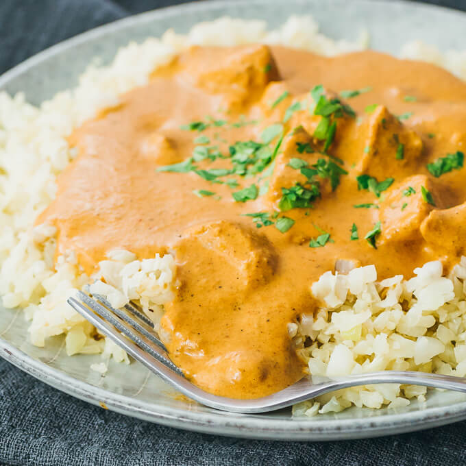 Slow cooker chicken tikka masala recipe plated with cauliflower rice