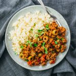 An easy-to-make beef picadillo served with cauliflower rice on a plate