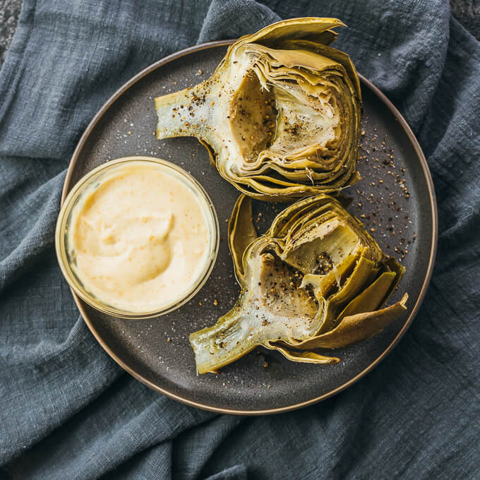 overhead view of artichokes on plate