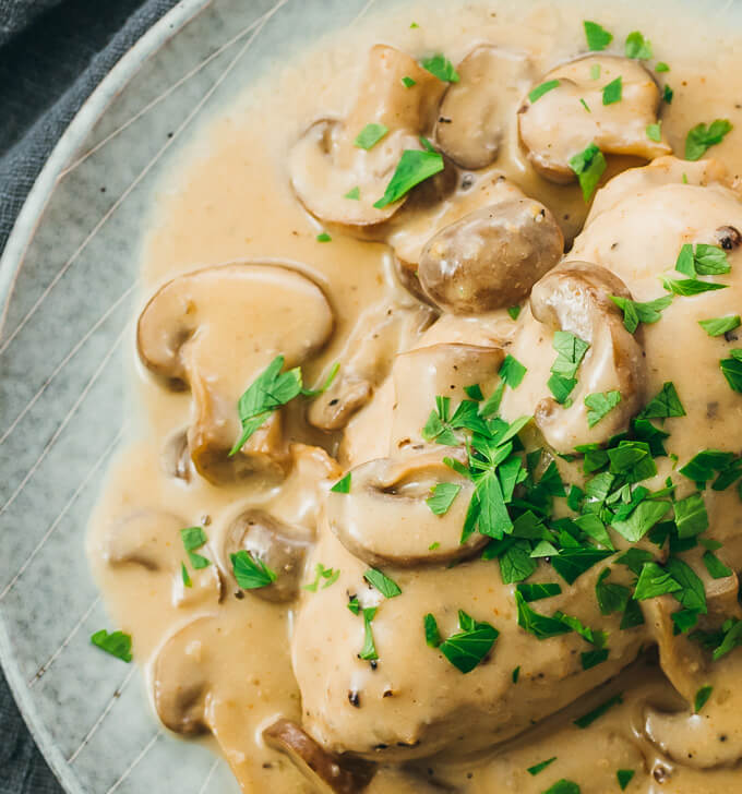 close up view of chicken with mushroom gravy