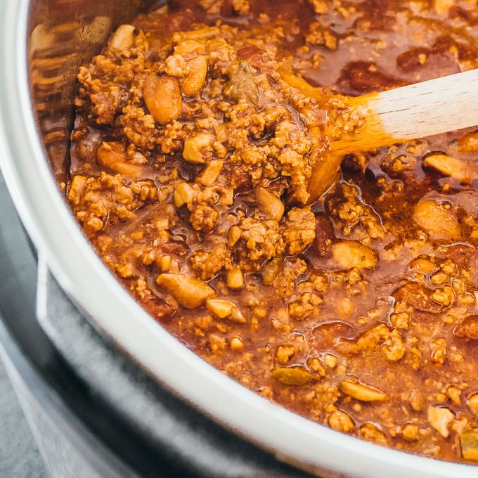 Chili with ground beef and canned beans being made in an instant pot pressure cooker