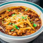 Low carb ground beef chili with beans served in a bowl and made in the instant pot pressure cooker