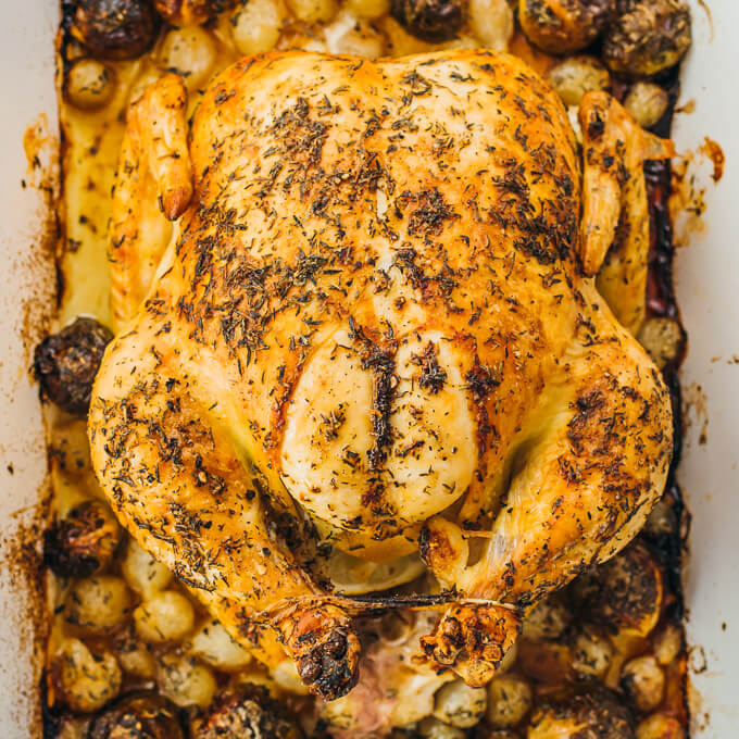 roast chicken with vegetables in casserole dish