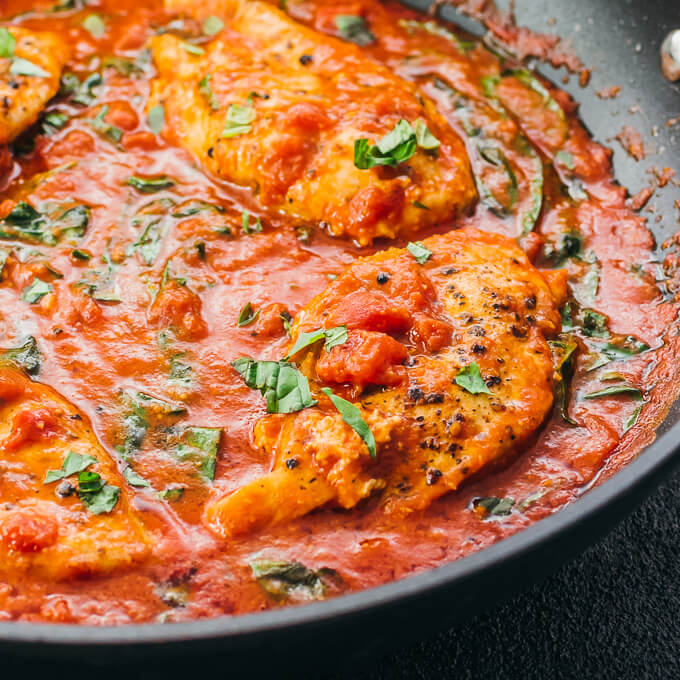 close up view of chicken in tomato sauce