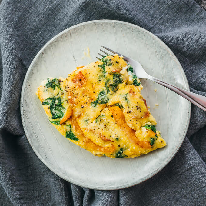 overhead view of spinach frittata served on plate