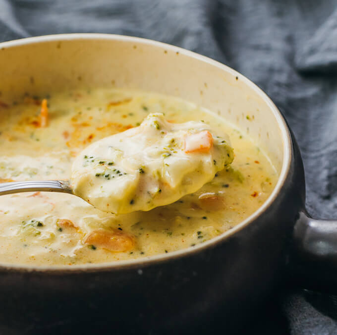 spooning up some broccoli cheese soup