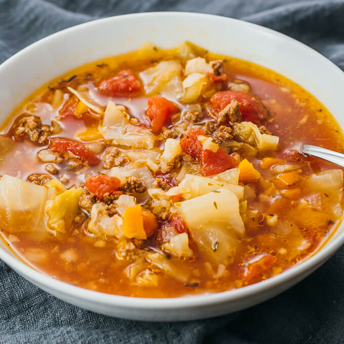 cabbage soup served in white bowl