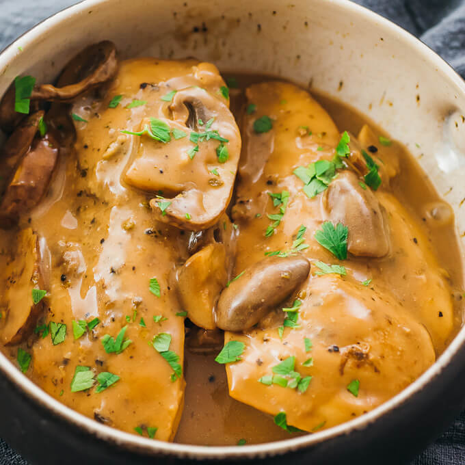 Instant Pot chicken marsala served in a bowl with mushrooms and a creamy brown sauce