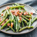 Instant Pot green beans and ham served on a gray plate