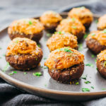 crab stuffed mushrooms served on plate