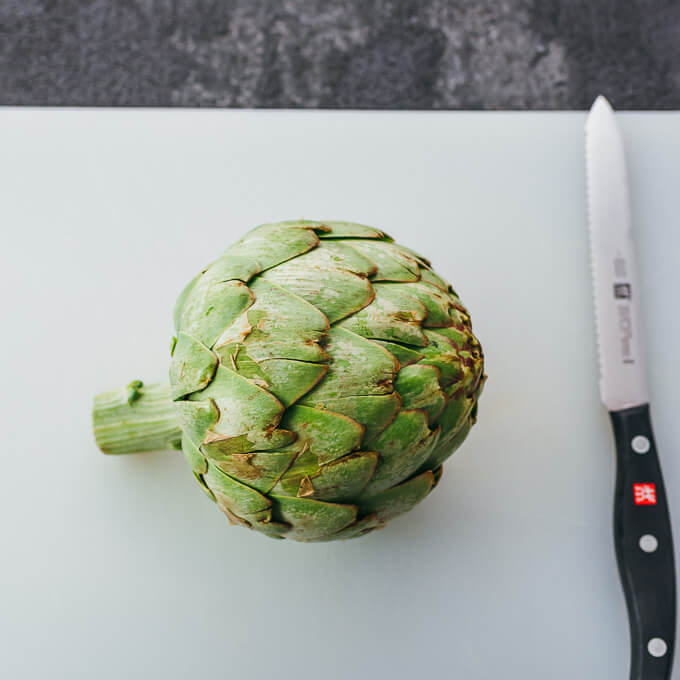 artichoke on cutting board