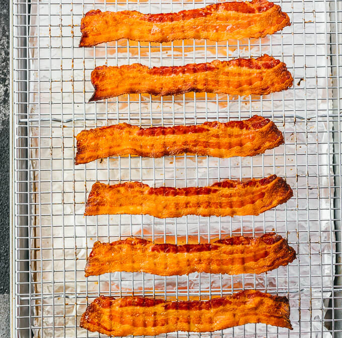 cooked bacon slices on baking tray