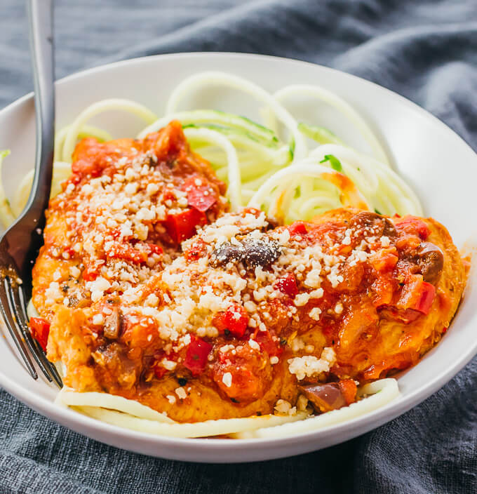 chicken cacciatore topped with parmesan cheese