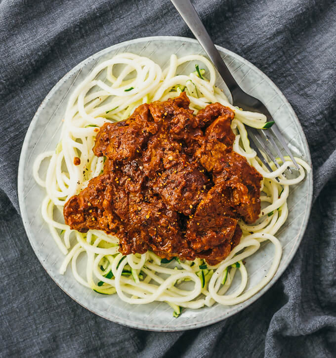 adobo beef served on top of zucchini noodles
