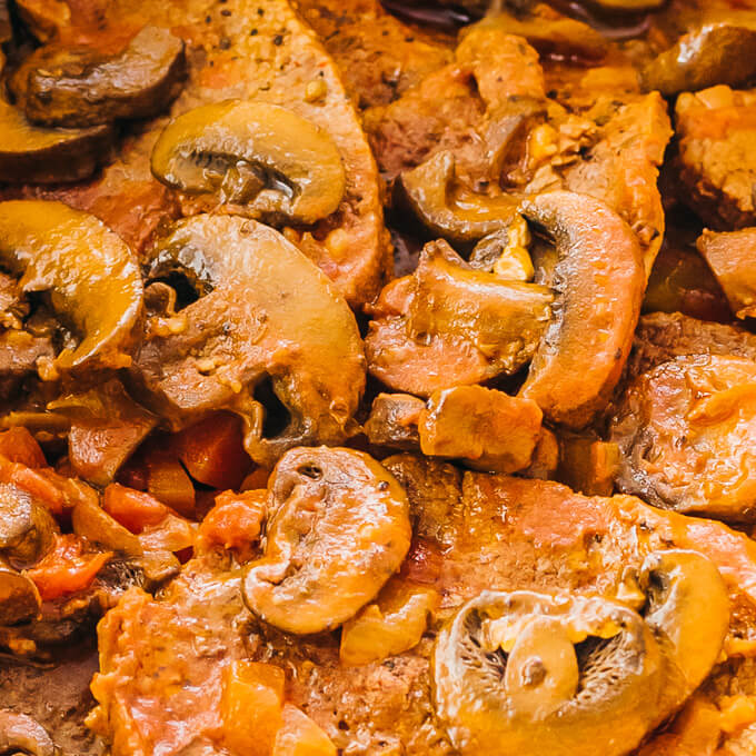 swiss steak topped with mushrooms