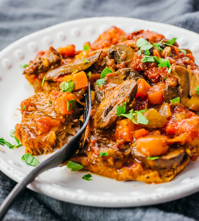 cutting into swiss steak