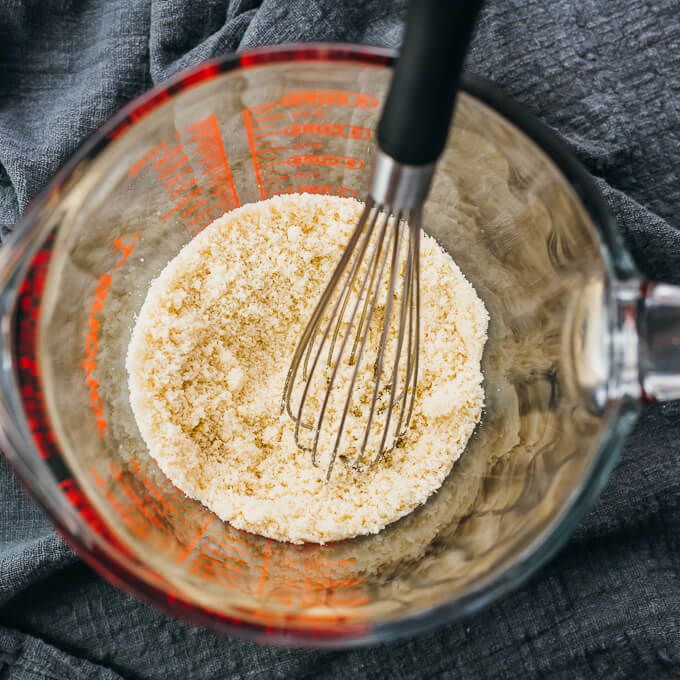 mixed keto pancake ingredients in glass bowl