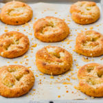 baked garlic knots on parchment paper