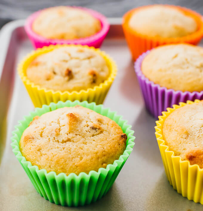 baked banana nut muffins on baking sheet