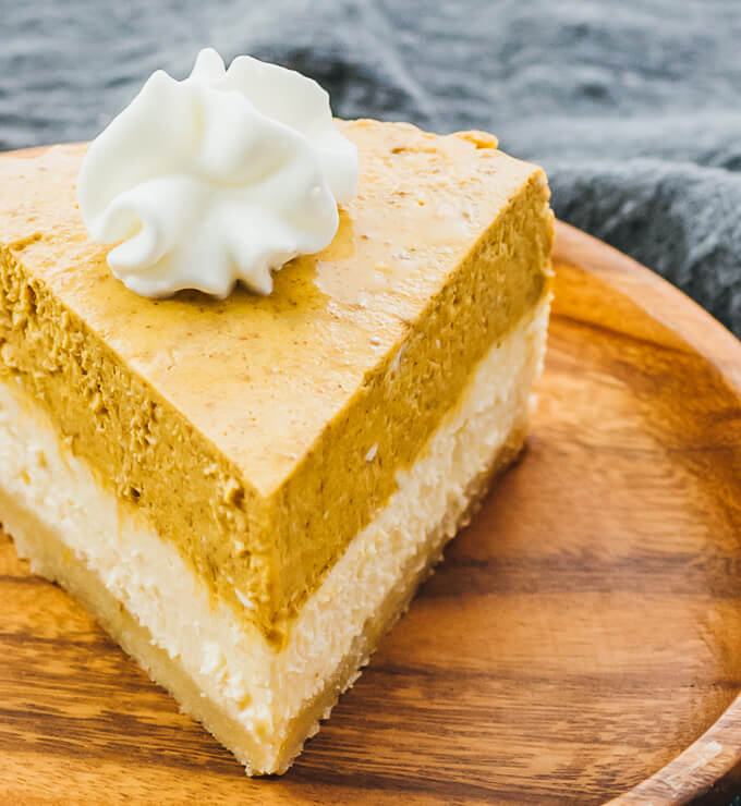 slice of keto instant pot pumpkin cheesecake on a wooden plate