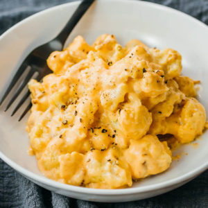 cauliflower mac and cheese served in white bowl