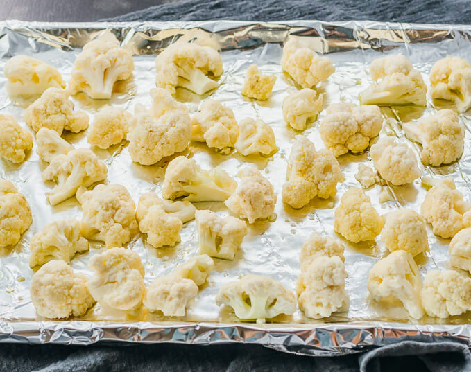 cauliflower florets on foil lined baking sheet