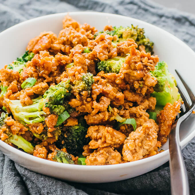 pork stir fry served in white bowl