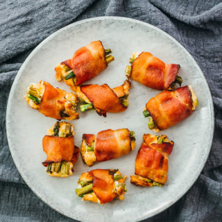 bacon wrapped asparagus bites served on plate