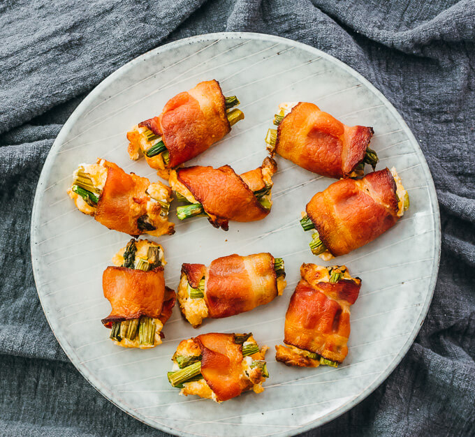bacon wrapped asparagus bites served on plate