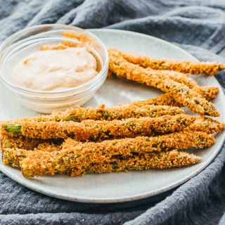 fried asparagus spears served with dip