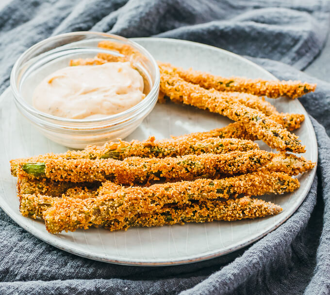 fried asparagus spears served with dip