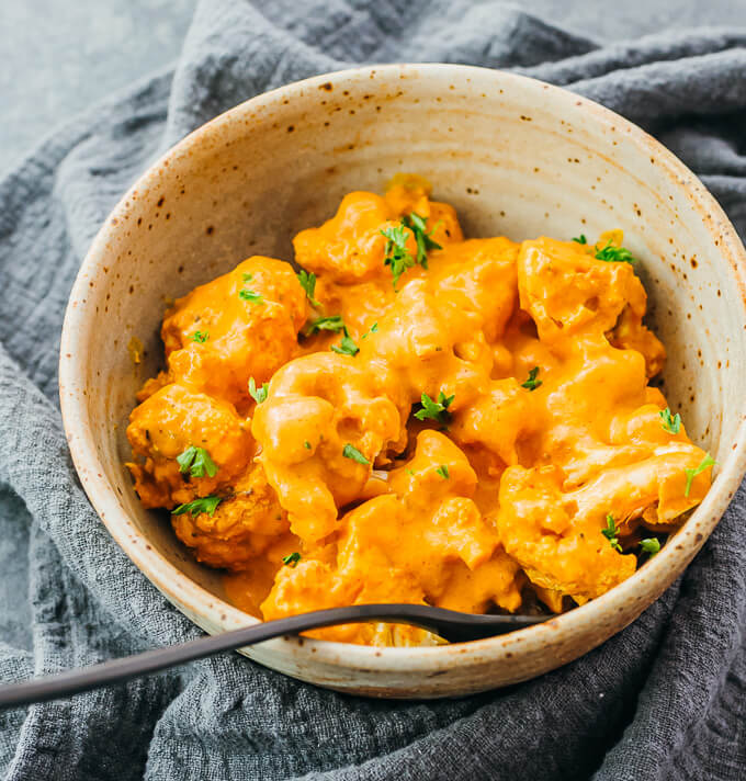 cauliflower curry served in stoneware bowl